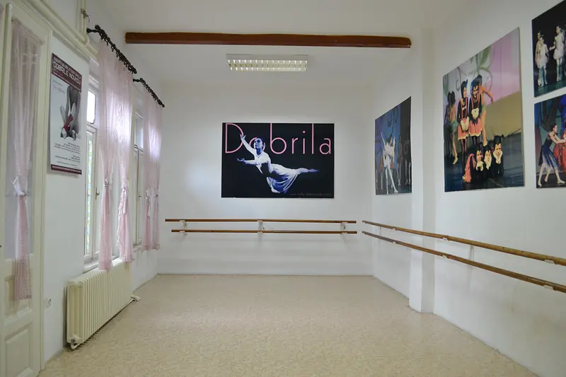 The La Sylphide ballet studio: barres along the walls, mirrors and photographs from performances